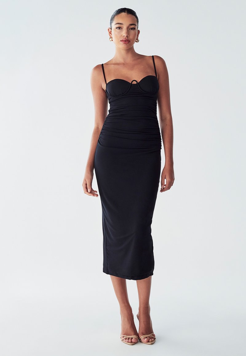 Black midi dress with a fitted silhouette, thin spaghetti straps, ruching at the sides, and a keyhole detail at the bust. Smooth fabric.