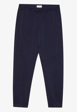 Navy blue jogger pants with elastic waistband and drawstring, side pockets, and cuffed ankles, labeled Pier One.