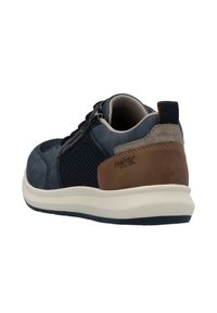 Men's casual shoe with navy blue mesh upper, leather accents in brown, grey heel, and white sole. Features zipper closure for easy wear.