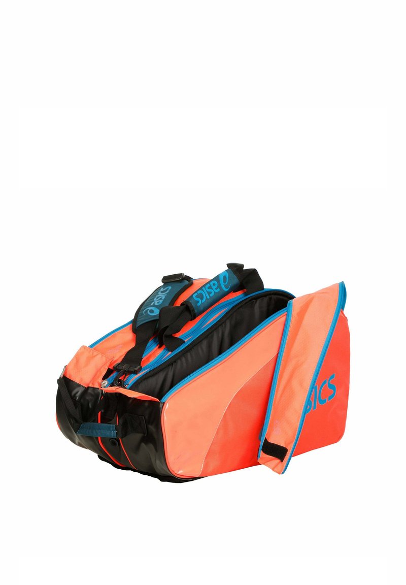 Orange and black ASICS sports bag with multiple zippered compartments, blue accents, and padded shoulder straps, shown open and empty.