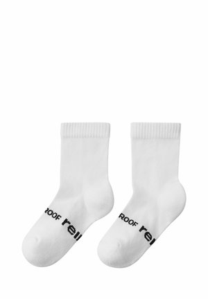 Weiße Baumwollsoffittchen mit gerippten Bündchen, die auf der Seite den schwarzen Text "Dach" tragen. Glatte Textur und schlichtes Design.