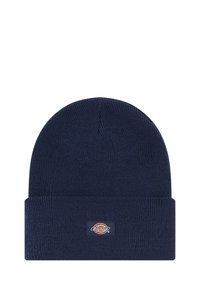 Gorra de punto azul marino con puño doblado que presenta un pequeño parche rectangular con el logo de la marca Dickies centrado en la parte delantera.