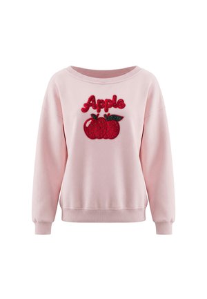 Pink sweatshirt med røde pailletæbler og ordet "Apple" skrevet med røde pailletter ovenover foran.