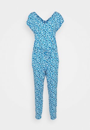 Combinaison courte bleue à manches courtes avec col en V et taille à cordon, présentant de petites fleurs blanches réparties uniformément sur le tissu.