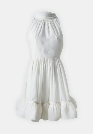 White halter dress made of smooth fabric, featuring a gathered bodice and a ruffled hem, creating a flared silhouette.