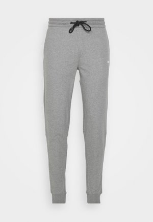 Szare spodnie dresowe wykonane z miękkiego materiału, z elastycznym pasem i czarnym sznurkiem do regulacji, zwężanymi mankietami oraz subtelnym logo na boku.