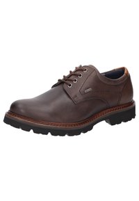 Bruine leren veterschoen met ronde neus, gestructureerd oppervlak, gestikte details en een robuuste rubberen zool voor grip.