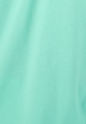 T-shirt en coton vert menthe, avec une texture lisse et un motif en maille côtelée. Aucun design ou accent visible. Couleur simple et unie.