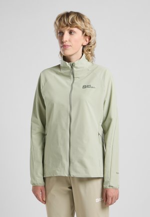 Light green jacket made of smooth material with a high collar, front zipper, and side pockets. Features subtle branding in dark green.