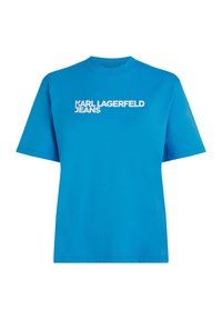 Plava pamučna majica s kratkim rukavima i okruglim izrezom. Na prednjoj strani prikazan je bijeli tekst logotipa: "KARL LAGERFELD JEANS."