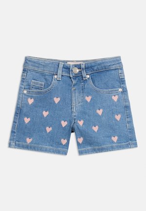 Sinised teksapüksid roosade tikitud südamekestega esiküljel, esist taskutega, vööaasade ja nööpklõpsuga.