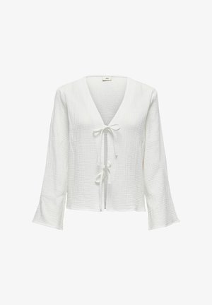 Blouse blanche à manches longues avec un décolleté en V, fermeture à nouer à l'avant, tissu texturé et manches évasées, présentant un aspect doux et froissé.