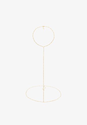 Gold-colored wire stand with a round top and circular base, featuring a textured surface and delicate, evenly spaced accents.