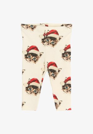 Puuvillalegginsid, millel on ribakujuline tekstuur ja korduv muster punaste jõulusokkidega kassidest kreemival taustal.