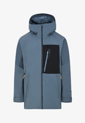 Chaqueta exterior azul con un bolsillo en el pecho con cremallera negra, dos bolsillos frontales y puños ajustables. Fabricada con material impermeable y suave al tacto.