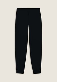 Pantalones de chándal negros de corte tapered con una textura suave y puños elásticos, que presentan un diseño minimalista y sin adornos visibles.