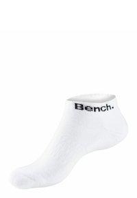 White ankle sock made of soft fabric, featuring ribbed texture and a black "Bench." logo near the cuff.