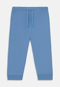 Pantalons de survêtement bleu clair en tissu doux, dotés d'une taille élastique avec cordons de serrage réglables et de bas de jambes resserrés.