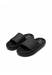 Infradito neri realizzati in materiale texturizzato, caratterizzati da una larga fascia e una suola in gomma liscia per il massimo comfort. Design semplice senza motivi.