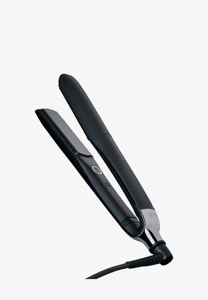 Fer à lisser électrique noir avec plaques chauffantes plates, bouton d'alimentation et cordon d'alimentation attaché, sur un fond uni.
