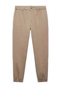 Pantalon fuselé beige avec une texture lisse, des poignets élastiqués, une fermeture par bouton et des poches latérales. Design minimaliste sans motifs.