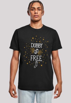 Black cotton t-shirt featuring "DOBBY IS FREE" in white and golden text with star patterns and a sock graphic. Short sleeves and crew neck.