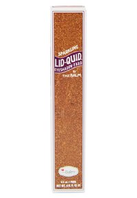 Gouden glinsterende verpakking met paarse tekst, met de tekst "Sparkling Lid-Quid Eyeshadow" en "door The Balm." Bevat 4,5 ml product.