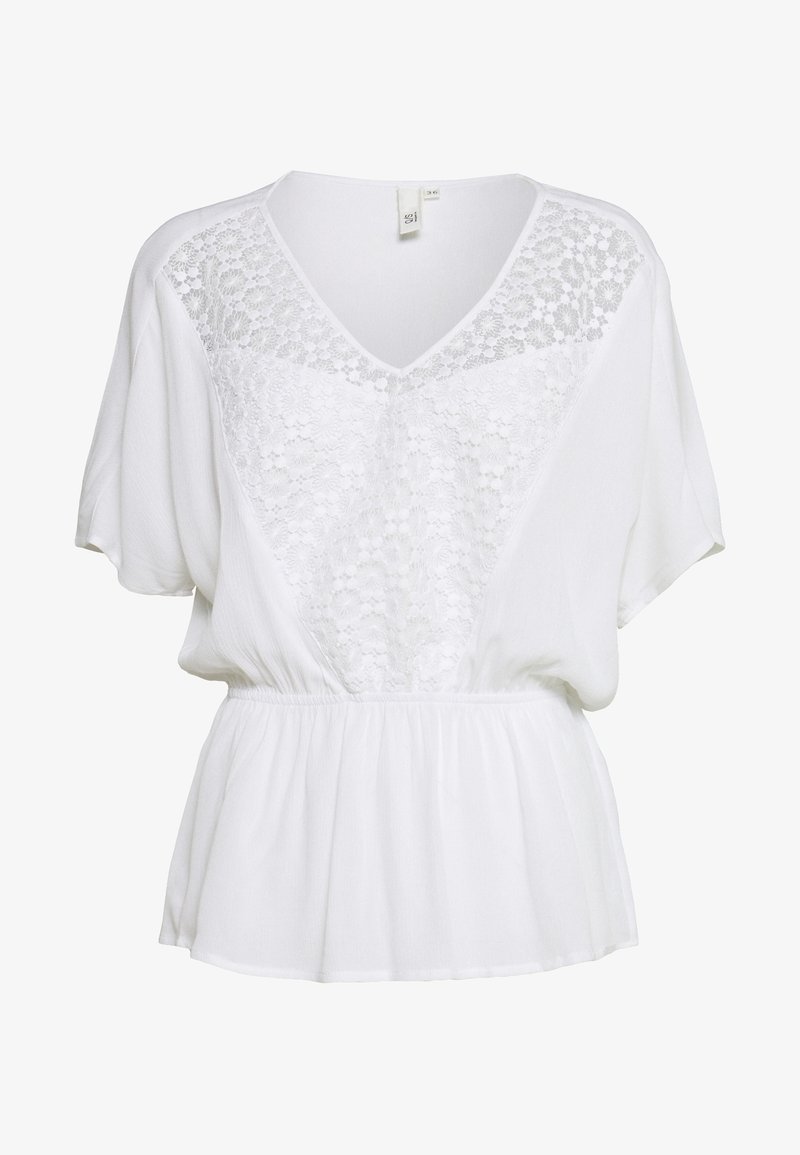 Blusa bianca con maniche corte, scollatura a V e dettagli in pizzo sul davanti. Tessuto morbido con vita arricciata per una vestibilità rilassata.