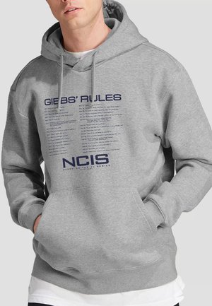 Gray hoodie featuring "GIBBS' RULES" text in navy blue, front pocket, drawstring hood, ribbed cuffs, and hem, made of soft fabric.
