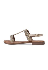 Gouden sandalen met kralen en T-strap ontwerp, voorzien van decoratieve uitsparingen en een gespsluiting rond de enkel. Platte bruine zool, van zacht materiaal.