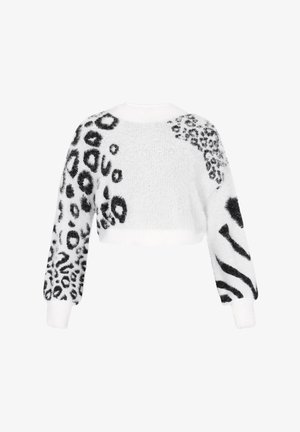 Supjaustyta balta megztinis su juodais gyvūnų raštais. Minkšta, pūkuota tekstūra, ilgomis rankovėmis, su skirtingais raštais ant kūno ir rankų.