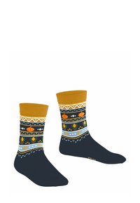 Wielokolorowe skarpetki na ciemnonawowym tle, z żółtymi i niebieskimi wzorami, w tym dyniami i kształtami geometrycznymi, z prążkowanymi musztardowymi ściągaczami.