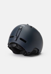 Casque de ski bleu marine foncé avec une finition mate, des fentes de ventilation, un système de réglage ajustable et un design élégant et arrondi avec des détails de logo.