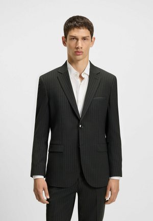 Black pinstriped suit jacket with notched lapels, single button closure, and two front pockets. Worn over a white shirt.