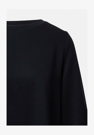 Black long-sleeve top with a round neckline, shown from the upper back on a plain light background.