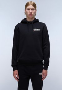 Black hoodie with a front logo patch, featuring a drawstring hood, ribbed cuffs, and hem, paired with black sweatpants.