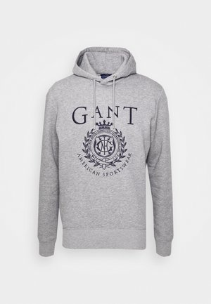 Sweat à capuche gris avec logo GANT à l'avant, emblème du blason et texte "American Sportswear", avec cordons de serrage et poignets et ourlet côtelés.