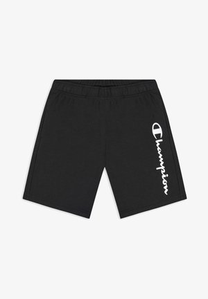 Pantaloni corti neri in cotone con elastico in vita, caratterizzati da una scritta logo verticale bianca sul lato sinistro. Texture morbida, design casual.