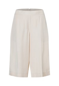 Beige Culottes mit einer taillierten Taille, weitem Bein und klaren Linien. Hergestellt aus glattem Stoff mit subtiler Textur, mit einem Reißverschluss auf der Rückseite.