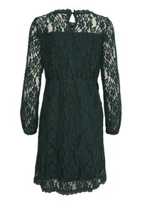 Robe longueur genou en dentelle florale vert foncé avec manches longues en tulle transparent et petite ouverture en forme de goutte dans le dos au niveau de l'encolure.