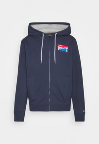 Marineblaue Zip-Hoodie mit einer Kordelzugkapuze, die ein graues Innenfutter und ein rot-weiß-blaues Logo auf der linken Brust zeigt.