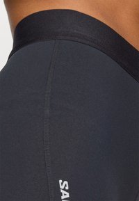 Salomon SENSE SHORT - Short running tights - deep black