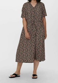 Floral black dress with short sleeves, knee-length, features a V-neck, button-down front, and a tie at the waist. Small multicolored floral pattern.