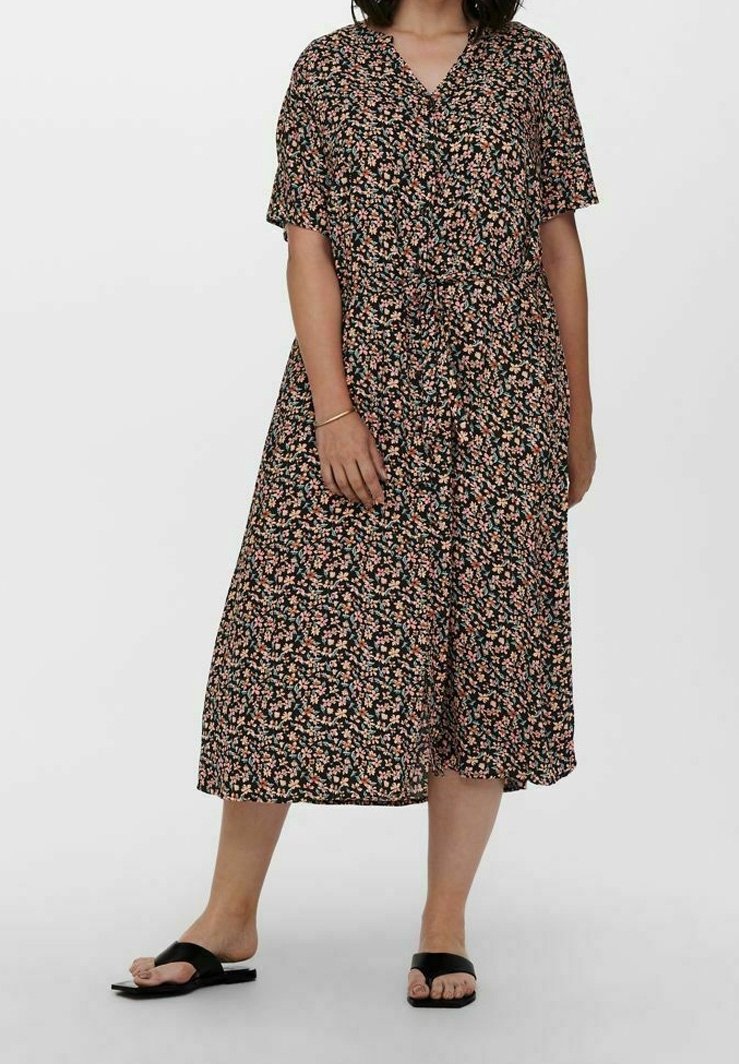 Floral black dress with short sleeves, knee-length, features a V-neck, button-down front, and a tie at the waist. Small multicolored floral pattern.