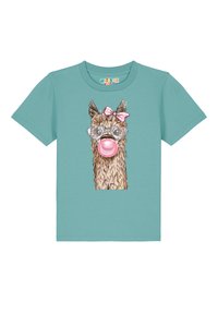 T-shirt turquoise avec une illustration de lama portant des lunettes de soleil en forme de cœur, un bubble gum rose et un nœud rose, en matériau coton doux.