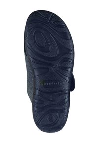 Black rubber shoe sole featuring textured grip patterns and a rounded shape. Includes a smooth edge and a label indicating "made in Italy."