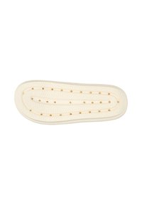 Shoe insole, cream color, rubber material, curved shape with textured surface, featuring multiple ventilation holes for breathability.
