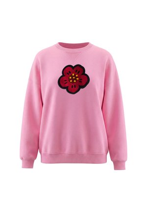 Pink langærmet sweatshirt med ribkanter ved ærmer og bund, med en stor rød blomst med sort omrids og gule detaljer på brystet.