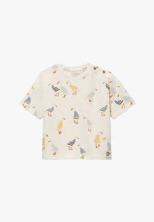 Chemise pour tout-petit de couleur crème à manches courtes, décorée d’illustrations de canards rayés en bleu, jaune et orange, avec des détails de boutons à l’épaule.