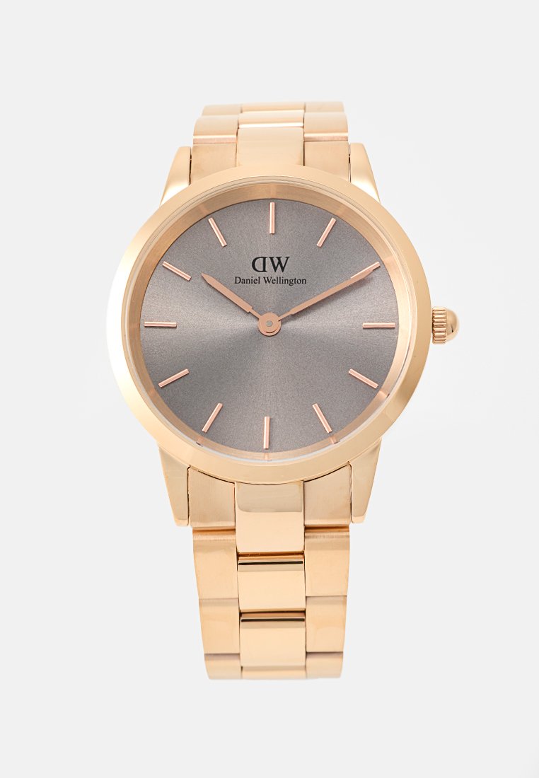Round rose gold watch with a gray dial, rose gold hands, and hour markers. Features a linked bracelet and a crown on the side.